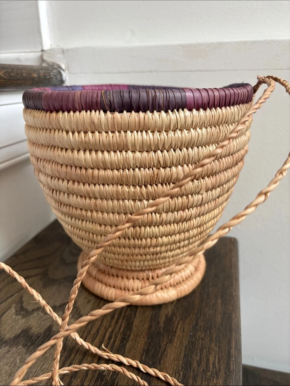 Woven palm leaves? footed basket, purple stripe on rim, 7.5” tall